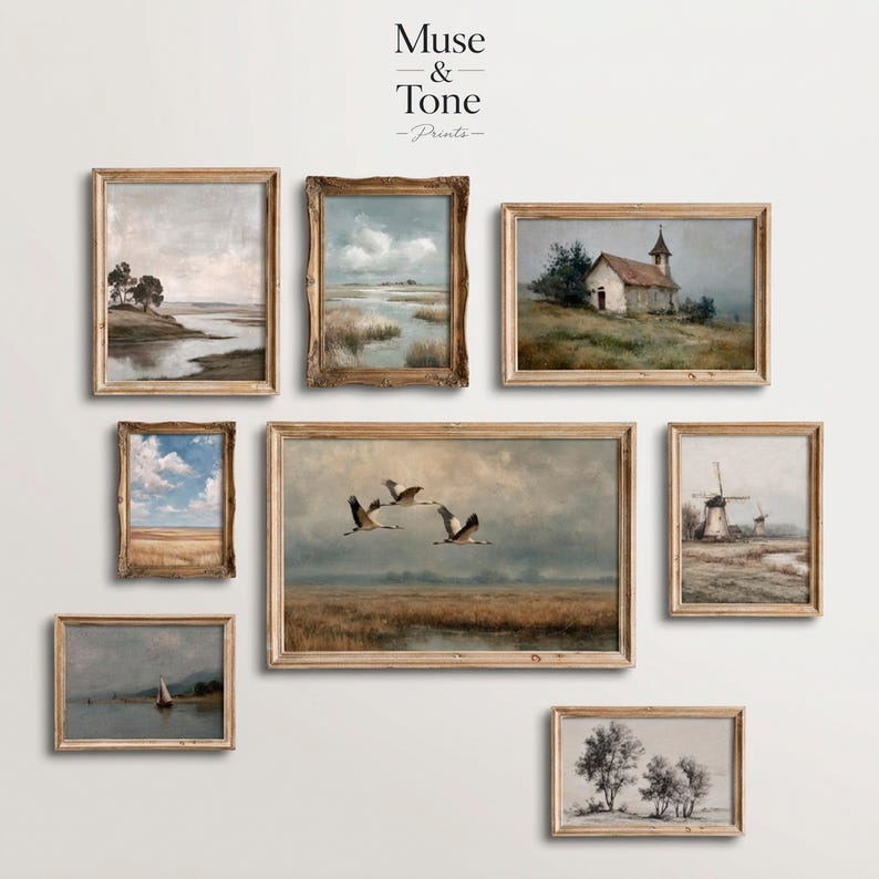 May include: Collection of framed landscape art prints. The prints feature serene scenes of nature, including a river, marsh, church, windmills, and flying birds. The frames are a light brown color, and the art has a vintage aesthetic.