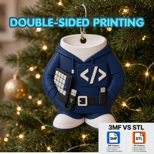 Op de afbeelding: Een marineblauw ornament in de vorm van een hoodie met een wit code-haakje symbool, een toetsenbord en USB-aansluitingen. De tekst DOUBLE-SIDED PRINTING staat bovenaan. Een grafiek onderaan vergelijkt 3MF VS STL bestandsformaten met technische kenmerken.