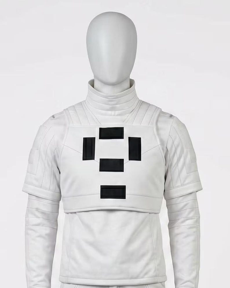 May include: A white futuristic-style outfit with a high collar and short sleeves. The chest area features a design of four black rectangles arranged in a square pattern. The outfit is made of a smooth, possibly leather-like material.