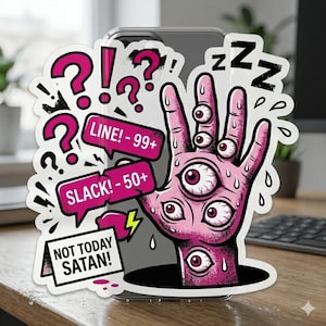 May include: A white ceramic mug with a black handle and the text "But First, Coffee" in a bold, black font. The mug is set against a blurred background, suggesting a cozy setting.