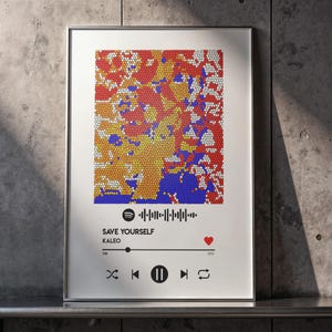 Puede incluir: Impresión artística enmarcada con un diseño de mosaico colorido en rojo, naranja, amarillo y azul. La impresión incluye una interfaz estilo Spotify con el título de la canción "SAVE YOURSELF" de Kaleo y un icono de corazón.