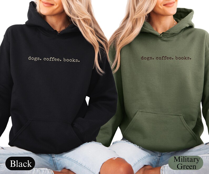 May include: Black and military green hoodies with the text "dogs. coffee. books." printed in a simple font. The hoodies have a front pocket and a hood. The models are wearing blue jeans.