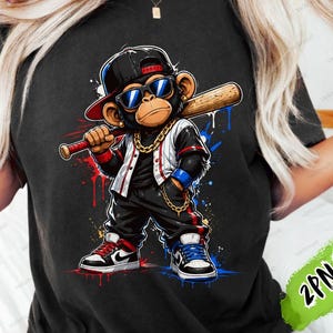 May include: Black t-shirt featuring a cartoon monkey wearing sunglasses, a baseball cap, and a gold chain, holding a baseball bat. The monkey is dressed in a baseball uniform with red, white, and blue accents. The text "DIGITAL PRODUCT - INSTANT DOWNLOAD" is at the bottom.