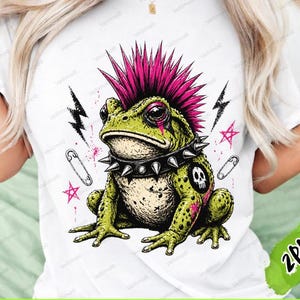 May include: White t-shirt featuring a punk rock frog with a pink mohawk, studded collar, and lightning bolt graphics. The frog is green with black and pink accents. Text at the bottom reads "DIGITAL PRODUCT - INSTANT DOWNLOAD".