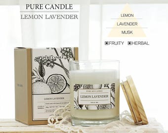May include: A soy candle in a clear glass jar with a wooden lid, labeled "Lemon Lavender." The candle is in a box with the text "Pure Candle Lemon Lavender" and botanical illustrations. The scent is described as fruity and herbal.