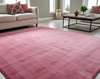 Alfombra moderna de lana rosa maciza con mechones hechos a mano para sala de estar.
