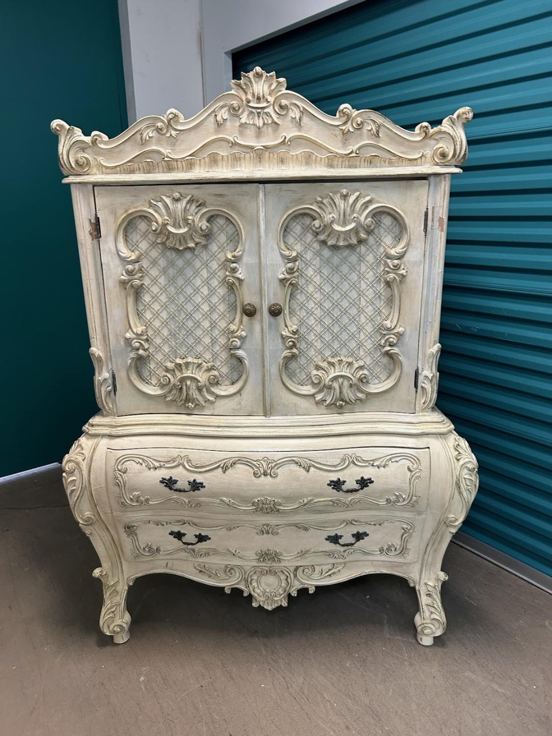 Vintage French Rococo Heavily Carved Wood And Chicken Wire Armoire