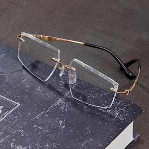 Lunettes légères et personnalisables sans monture. Toutes les ordonnances sont les bienvenues. Options lumière bleue, photochromique et polarisation disponibles.