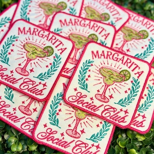 May include: A collection of embroidered patches with a margarita cocktail design. Each patch features the word "Margarita" above a cocktail illustration, with "Social Club" below. The patches have a white background with pink and green accents.