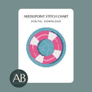 Op de afbeelding: Een needlepoint steekpatroon als digitale download met een gepixelde reddingsboei-afbeelding. De reddingsboei is cirkelvormig met afwisselende roze en witte segmenten, omlijnd in blauwgroen, op een witte rechthoekige achtergrond met tekst.