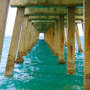Turquoise Ocean Under Pier Photo Print: Juno Beach Coastal Art
