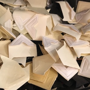 24 vintage gummed photo corners. Options: black, red, green, or white, for scrapbooks or photo albums
