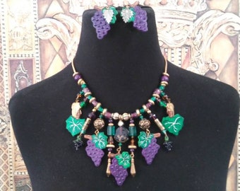 Designer signed Beau Regards 1988 purple grape Green Leaf beaded bib necklace and matching dangle earrings