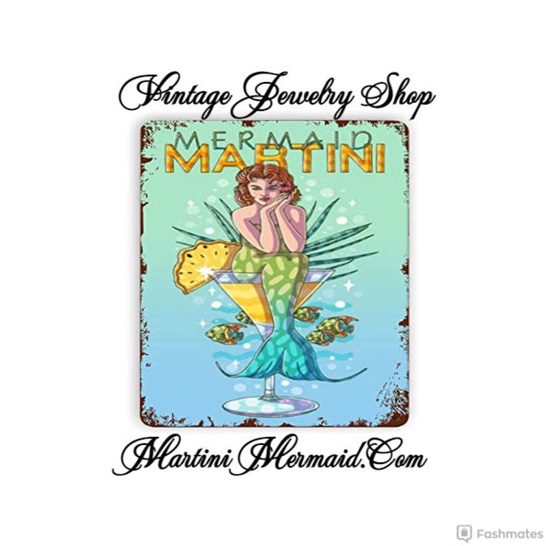 May include: A vintage-style metal sign featuring a mermaid sitting in a martini glass. The sign reads "Mermaid Martini" and "Martini Mermaid.com".