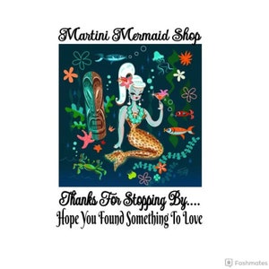 May include: A cartoon mermaid with a leopard print tail holds a martini glass. She is surrounded by tropical plants, fish, and a tiki idol. The text "Martini Mermaid Shop" is at the top of the image. The text "Thanks For Stopping By... Hope You Found Something To Love" is at the bottom of the image.