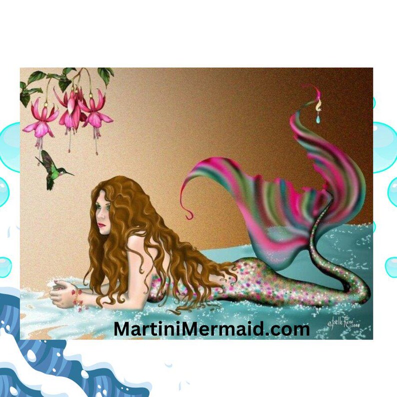May include: A digital illustration of a mermaid with long wavy brown hair resting on a sandy shore by turquoise water. She has a shimmering multicoloured tail, and a hummingbird flies near pink fuchsia flowers. The text MartiniMermaid.com is visible.