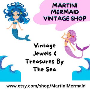May include: A logo for Martini Mermaid Vintage Shop featuring a blue-haired mermaid on the left and a purple-haired mermaid on the right. The text reads Martini Mermaid Vintage Shop, Vintage Jewels & Treasures By The Sea, and www.etsy.com/shop/MartiniMermaid.
