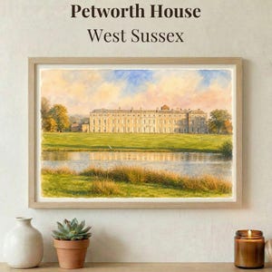 May include: A framed watercolor print of Petworth House in West Sussex. The artwork depicts a large, stately building with a long facade, set against a backdrop of a green lawn, a lake, and a blue sky. The text "Petworth House West Sussex" is at the top.