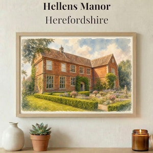 May include: A framed watercolor print titled Hellens Manor Herefordshire depicting a large red brick manor house with a gabled roof, surrounded by manicured green hedges, flowering garden beds, and trees under a soft blue sky with clouds.