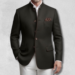 May include: A dark brown blazer with a mandarin collar, brown buttons, and a brown pocket square. The blazer has a tailored fit and is worn over a white shirt and white pants. The jacket has two front pockets.