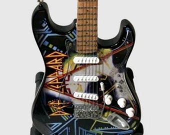 Def Leppard’s 10” Guitar Tribute with stand. 1:4 scale