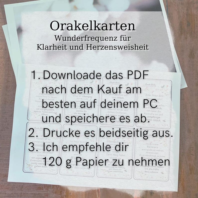 May include: A stack of oracle cards with text in German. The cards are white with black text and feature instructions for downloading and printing. The text includes "Orakelkarten" and "120 g Papier".