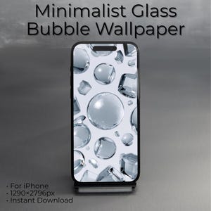May include: A smartphone displays a minimalist glass bubble wallpaper. The screen features a pattern of clear, spherical bubbles and geometric shapes against a white background. The phone is black and sits on a silver stand. Text at the top reads "Minimalist Glass Bubble Wallpaper."