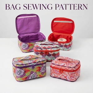 May include: Four rectangular cosmetic bags with zippered closures and top handles. Two bags are open, revealing purple and red interiors with pockets. The exterior fabrics feature floral and scalloped patterns in green, purple, red, and teal. Text reads BAG SEWING PATTERN.
