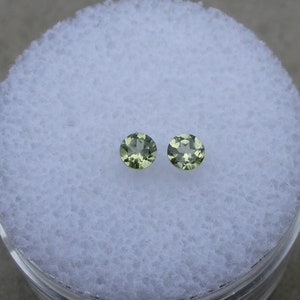 2 Peridot round loose gems 3mm each