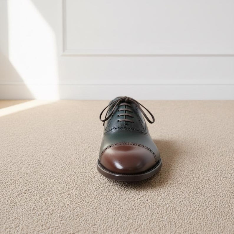Front perspective of elegant green brown formal brogue shoes with classic lace-up stylin
