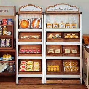 May include: Wooden bakery display shelves filled with various baked goods. The shelves are labeled "Naturals" and "Vegetables & fruits". The display includes bread, pastries, and other treats, arranged in wooden trays and clear packaging.