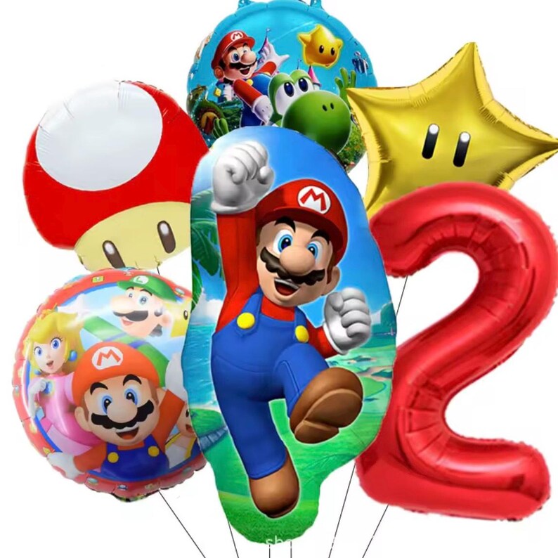 Może przedstawiać: Kolekcja kolorowych balon&oacute;w foliowych z postaciami z serii gier wideo Super Mario. Zawiera duży czerwony balon z cyfrą 2, złotą gwiazdę, czerwonego grzyba oraz balony z Mario, Yoshim i księżniczką Peach.