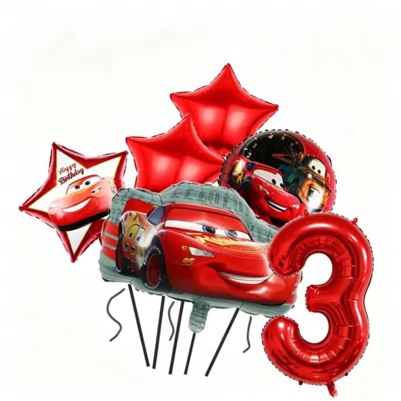 May include: A set of red foil balloons, featuring star shapes, car designs, and a number 3 balloon. One star balloon displays "Happy Birthday" and a cartoon car. These balloons are intended for a birthday party or celebration.
