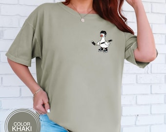 Gans Hockey-T-Shirt, lustiges Hockey-Gans-Shirt, niedliches Tiersport-T-Stück, Eishockey-Grafik-Shirt, Karikatur-Gans-Design, Geschenk für Hockey-Fans