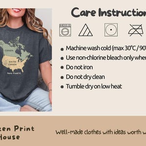 May include: A dark gray t-shirt featuring a map graphic of North America with the United States labeled as South Canada and the text Here: fixed it. The image includes care instructions for machine washing cold at 90&deg;F, non-chlorine bleach, and tumble dry.