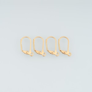 May include: Four gold-toned metal earring findings with a leverback closure mechanism. Each piece features a smooth, rounded arch shape and a small circular loop at the base for attaching jewellery components, presented in a horizontal row.