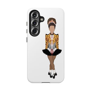 May include: A white phone case featuring a stylized illustration of an Irish dancer. The dancer is depicted in a traditional costume with a gold and black bodice, a black skirt, and brown legs. The phone case has a triple-lens camera.