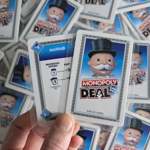 monopoly card sleeves 500 Credit Skin, Debit Card Covering Thicker card sleeves are nice but getting the cards back in the box and handling hugely overstacked decks is a big issue on games over 100 cards Monopoly Deal Card Sleeve Kit