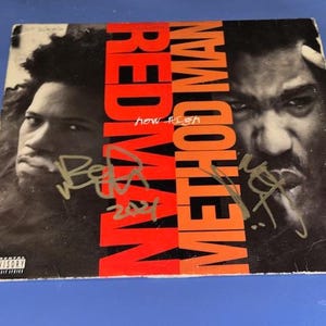 May include: Album cover featuring Redman and Method Man. The album title is in large red letters, with the artists' faces on either side. The cover has signatures and an advisory warning.