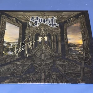 Álbum de discos Ghost Skeleta autografiado por Tobias Forge