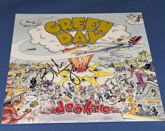 Billie Joe Armstrong z ręcznie podpisanym albumem Green Day Dookie Record