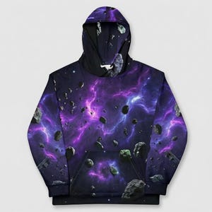 May include: A hooded sweatshirt featuring a vibrant space-themed design. The hoodie showcases a nebula of purple and blue hues, with scattered asteroids. The design covers the entire garment, including the hood and front pocket.