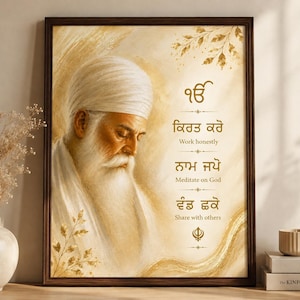 May include: A framed wall art print featuring a portrait of Guru Nanak Dev Ji in shades of gold and cream. The text includes the Ik Onkar symbol and the three pillars of Sikhism: Kirat Karo, Naam Japo, and Vand Chakko, with English translations.
