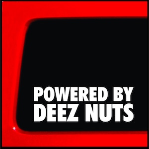 May include: A black and white sticker with the text "POWERED BY DEEZ NUTS" on a red background.