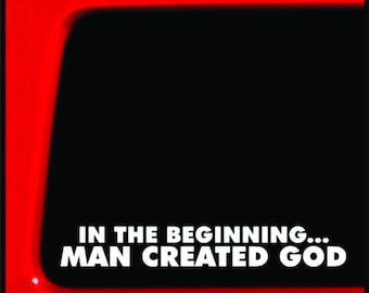 May include: A red and black sticker with the text "IN THE BEGINNING... MAN CREATED GOD" in white letters.