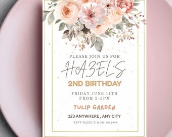 May include: A floral invitation card for a 2nd birthday celebration. The card features a bouquet of pink and peach flowers at the top, with gold text that reads "Please join us for Hazel's 2nd Birthday". The event details are included.
