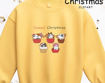 May include: Yellow sweatshirt with a "Sweet Christmas" graphic. The graphic features five cartoon cats in cupcake liners, each with a festive hat or decoration. The text "Sweet Christmas" is above the graphic.