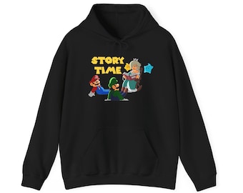 May include: A black hooded sweatshirt featuring a graphic print of Mario, Luigi, and Princess Rosalina sitting together. The text "STORY TIME" is printed in yellow above the characters, with a small blue star and a yellow star nearby.