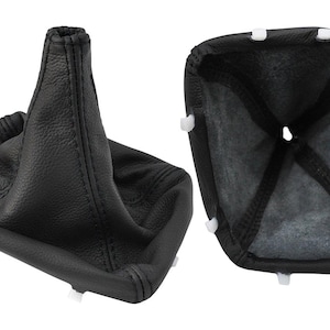 May include: Black leather shift boot with white plastic clips. The boot is shown from two angles, one fully assembled and the other showing the interior. The boot is made of a textured leather material.