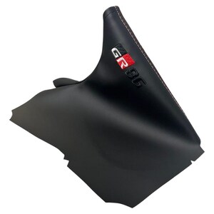 May include: Black car shift boot with red stitching. The boot features the embroidered text "GR 86" in white and red. The product is designed for automotive use.